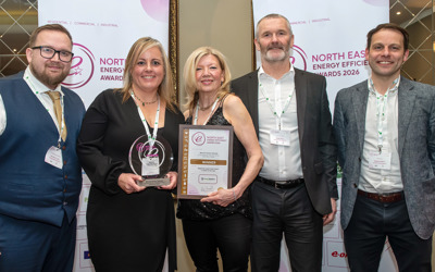 Group photo featuring North Star's trophy and certificate 
